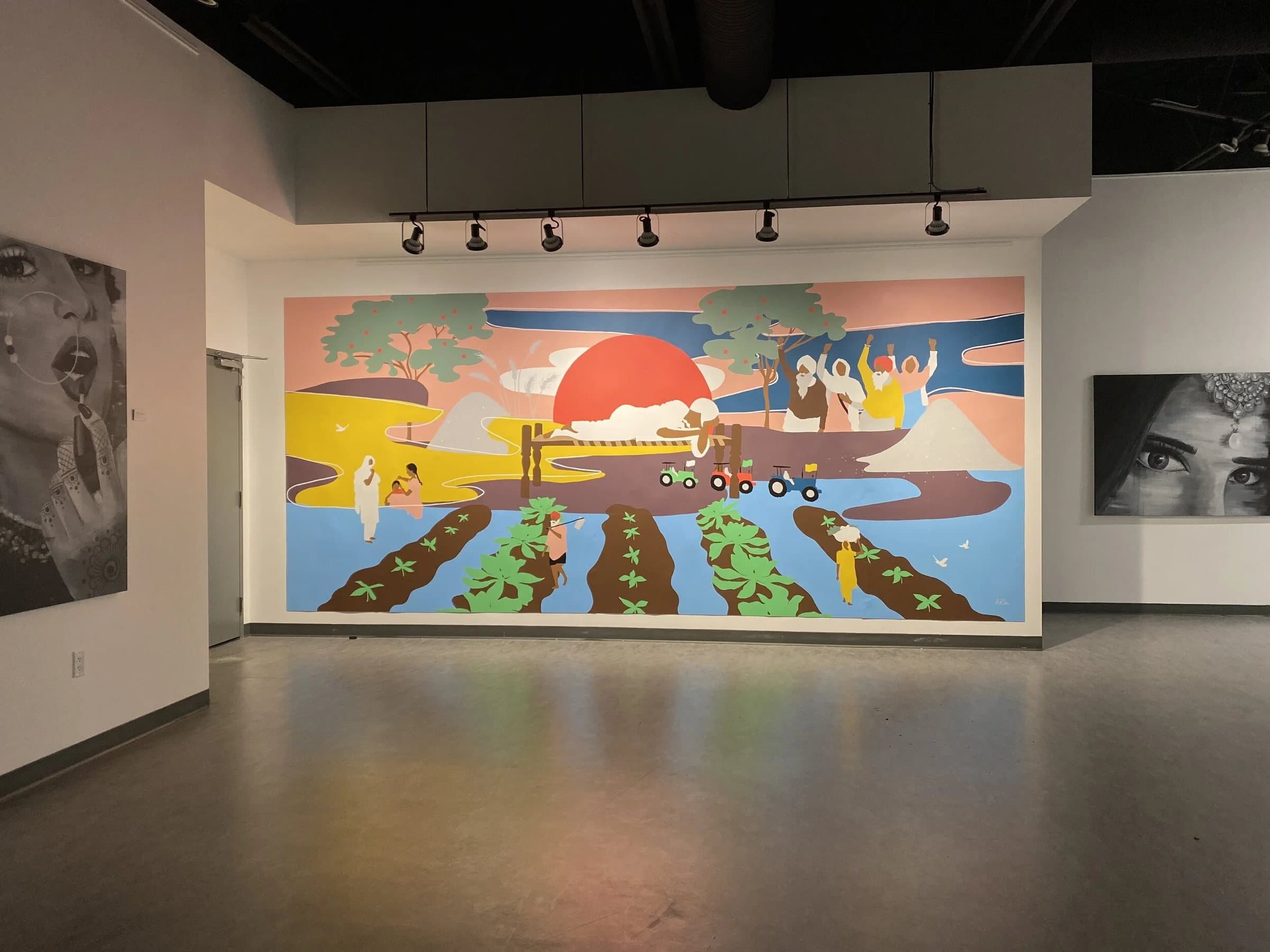Love for Humanity installed across the end wall of the gallery, with a black and white portrait on each side