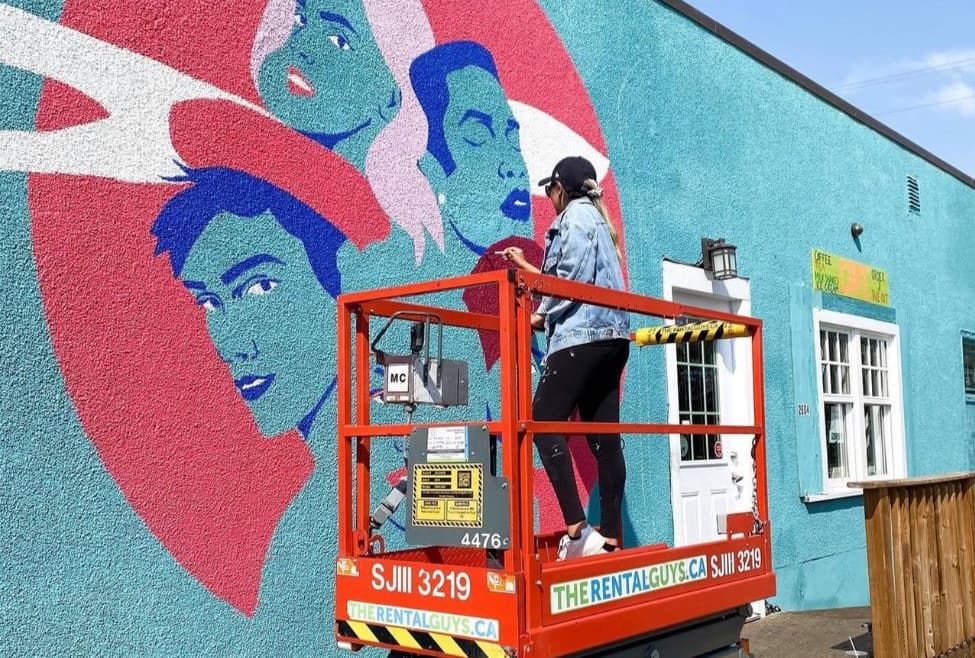 SAWA in progress: painting the faces inside the red circle from a scissor lift
