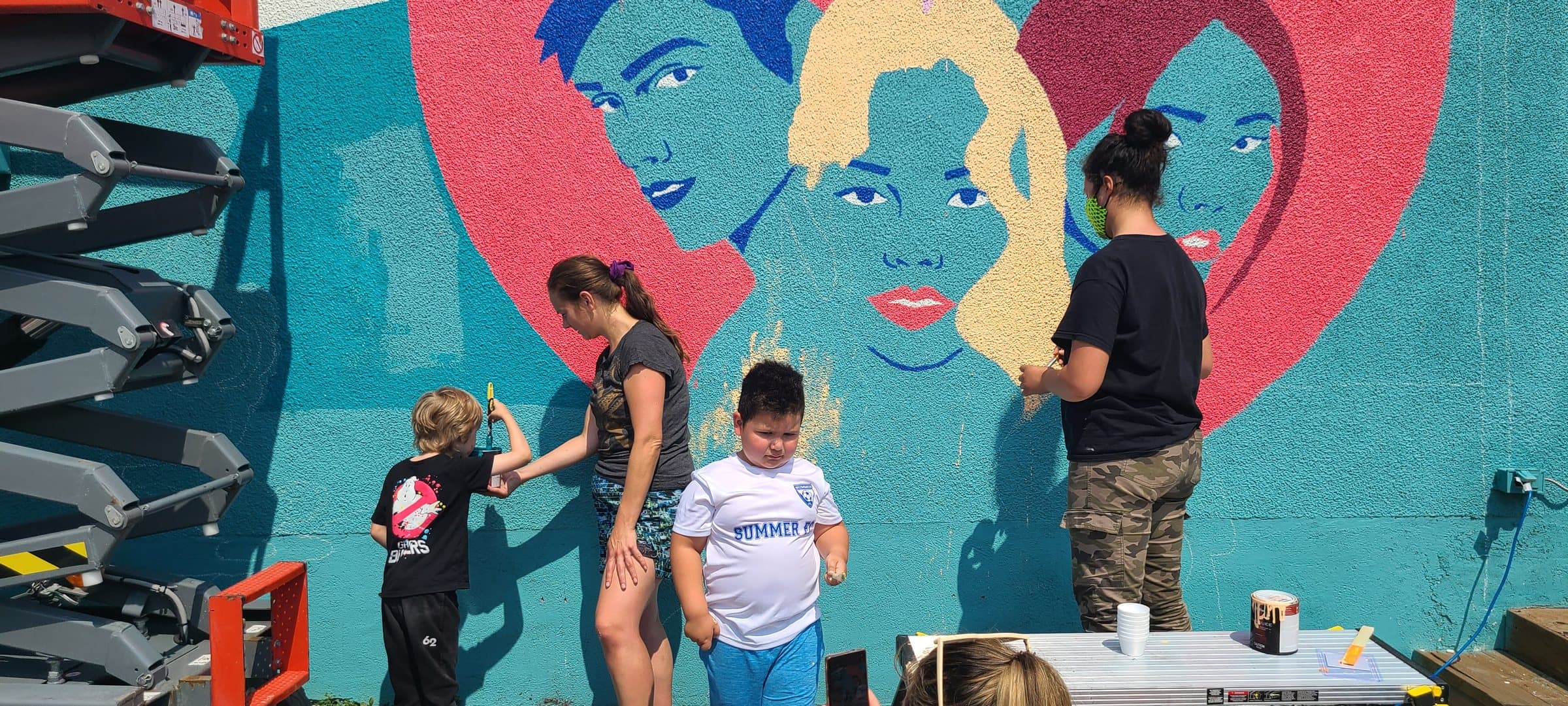 Community painting process for the SAWA mural
