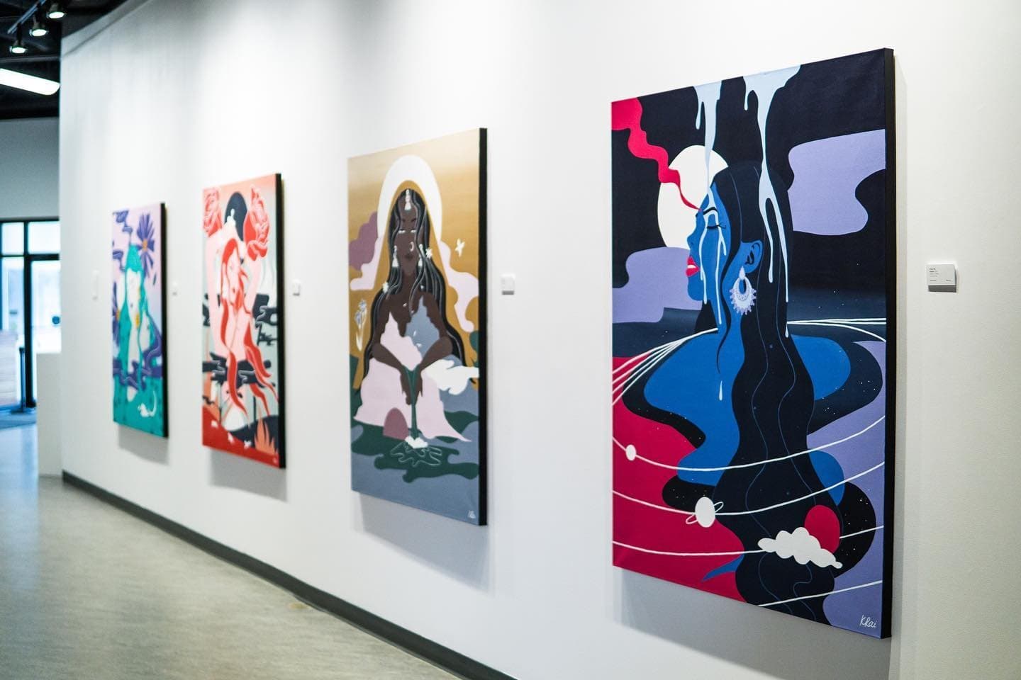 The four Maharani Mentality paintings hanging in a row at The Hub Gallery at artsPlace, Canmore
