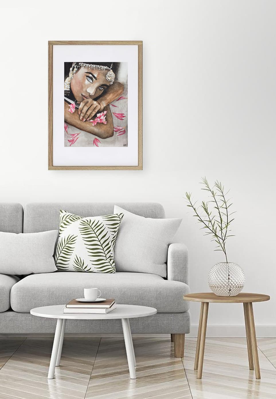 Sherni in a wooden frame on a white wall above a grey sofa, a mockup