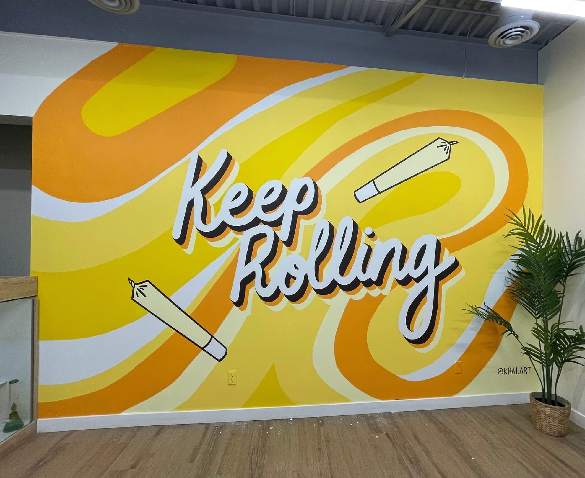 Keep Rolling typographic mural at Bud Mart Cannabis in Chestermere