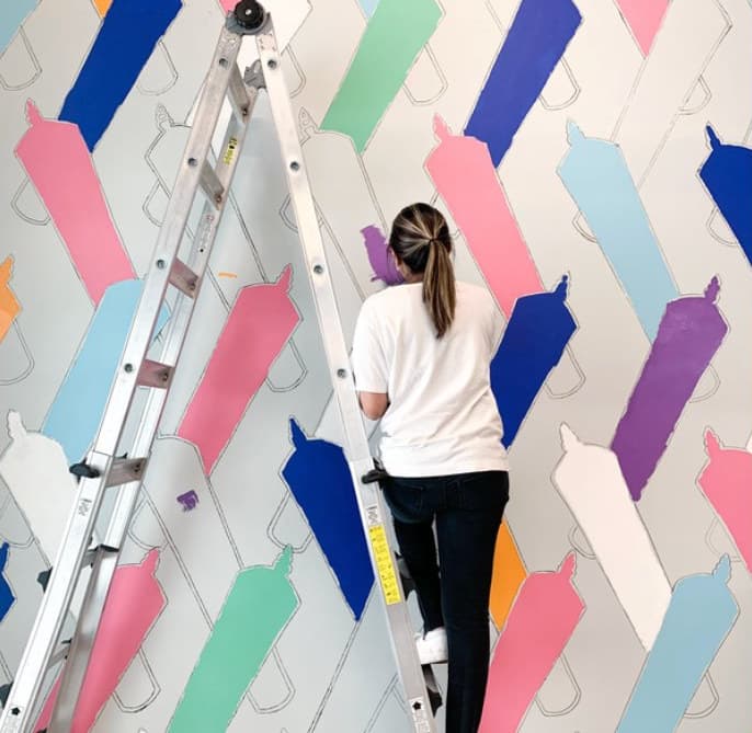 Rainbow Doobies in progress: painting the joints from a ladder, before the outlines go on