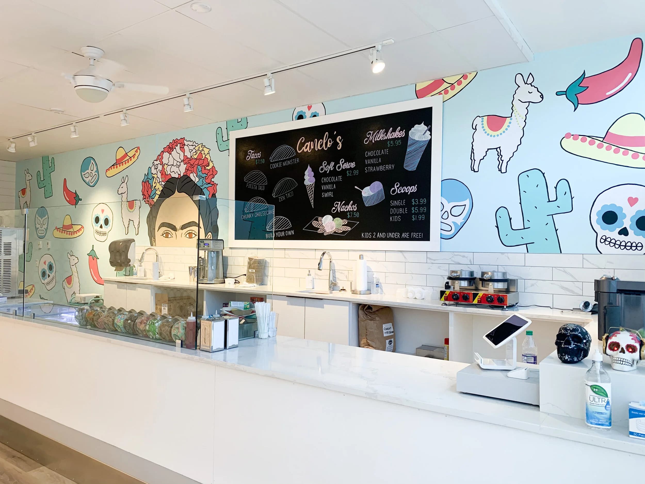 Viva Frida around the counter at Canelo's Ice Cream in Killarney, Calgary: Frida Kahlo among cacti, sugar skulls and llamas