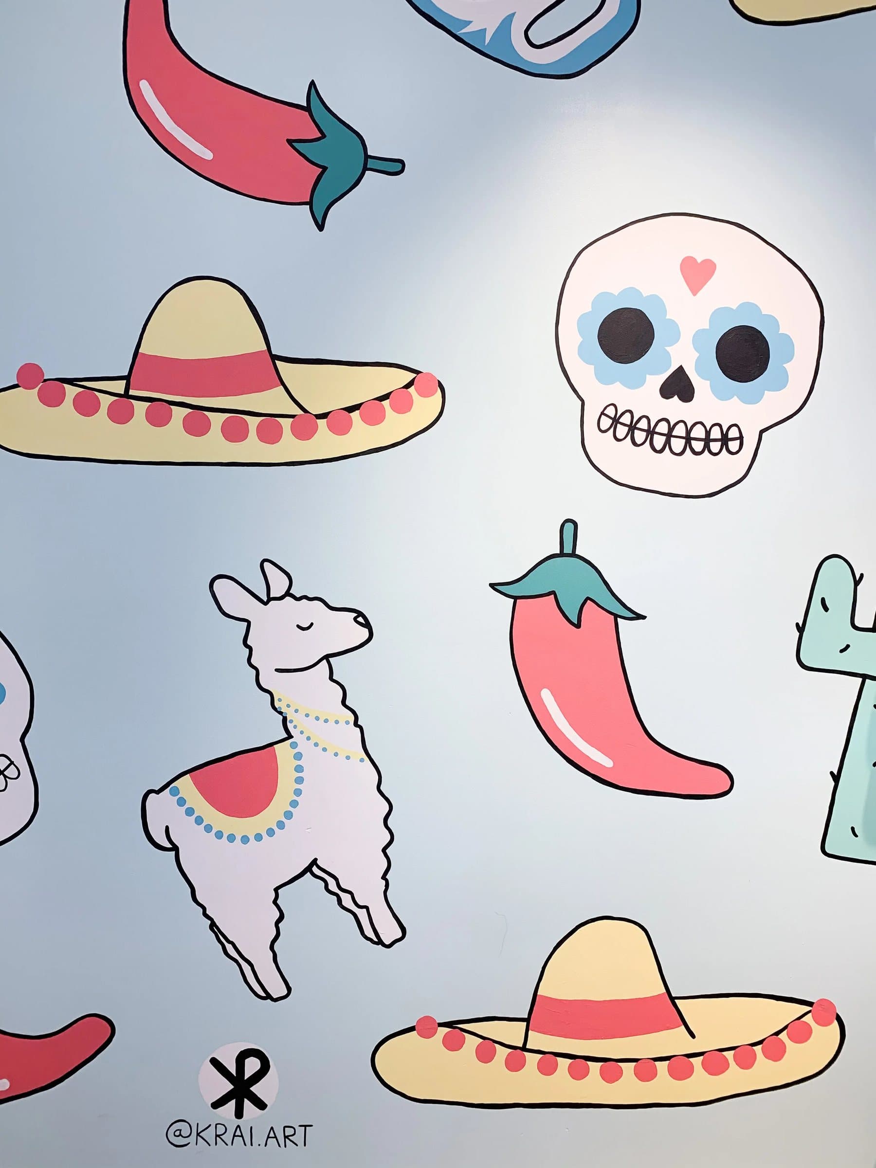 Detail of Viva Frida mural showing playful cacti and sugar skull motifs
