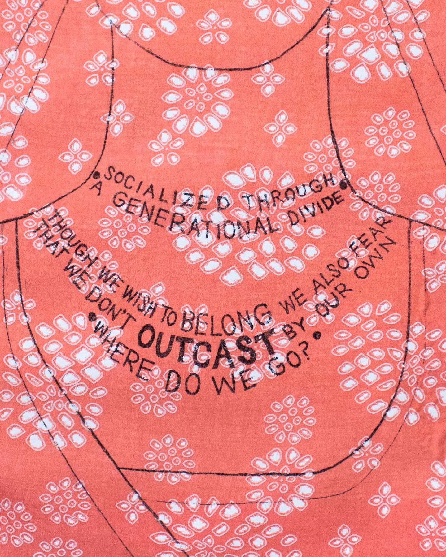 I Am the Diaspora I, lines of poetry drawn as a necklace across a woman’s collar, printed on coral fabric