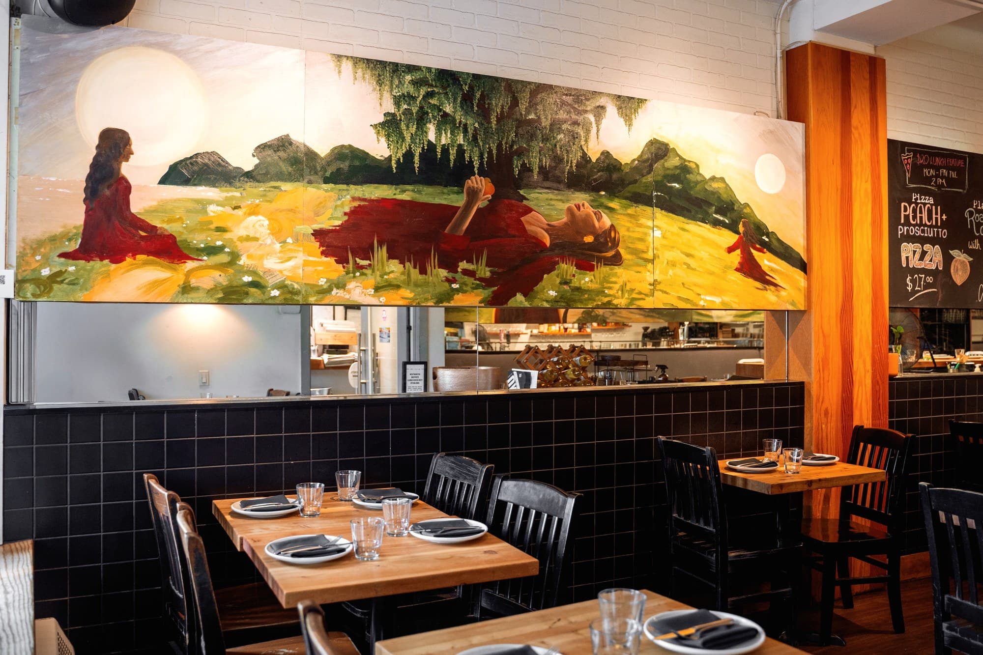 A Woman’s World installed at UNA Pizza + Wine on 17th Avenue, Calgary